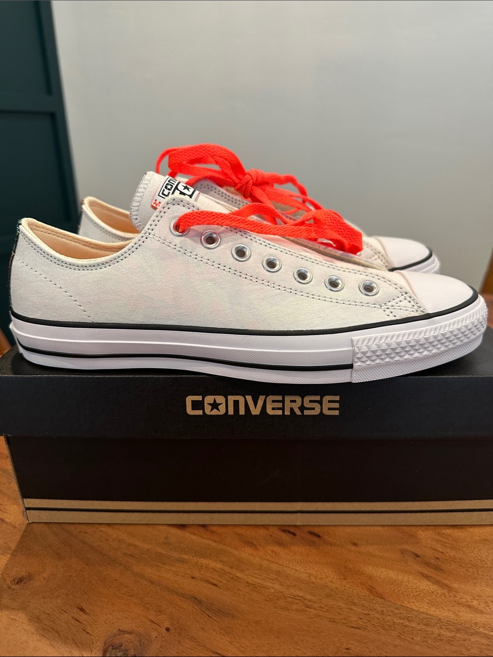 Converse Unisex Low Top Canvas Sneakers in White with NeonLaces